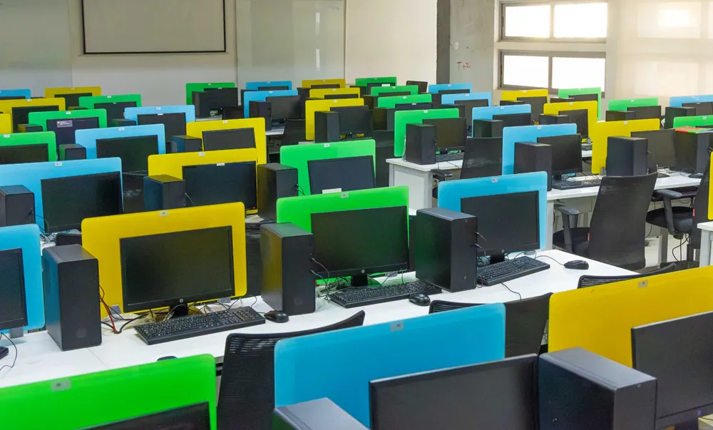 Computers and study desks in a Presidency University laboratory